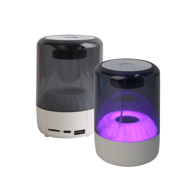 A portable Bluetooth speaker with a translucent casing, featuring a purple glow and multiple connectivity ports.