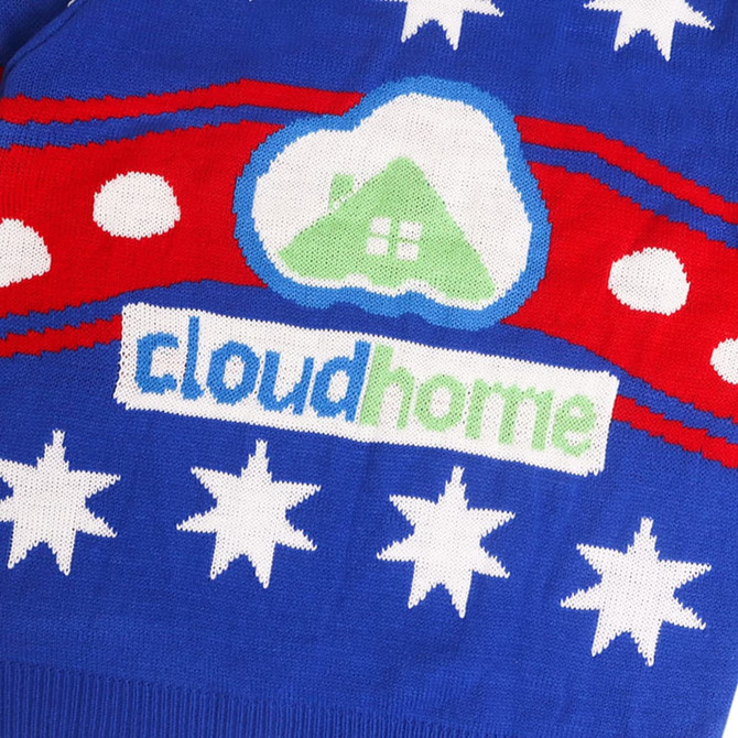 A blue unisex winter acrylic jacquard sweater featuring red stripes, white stars, and a logo.