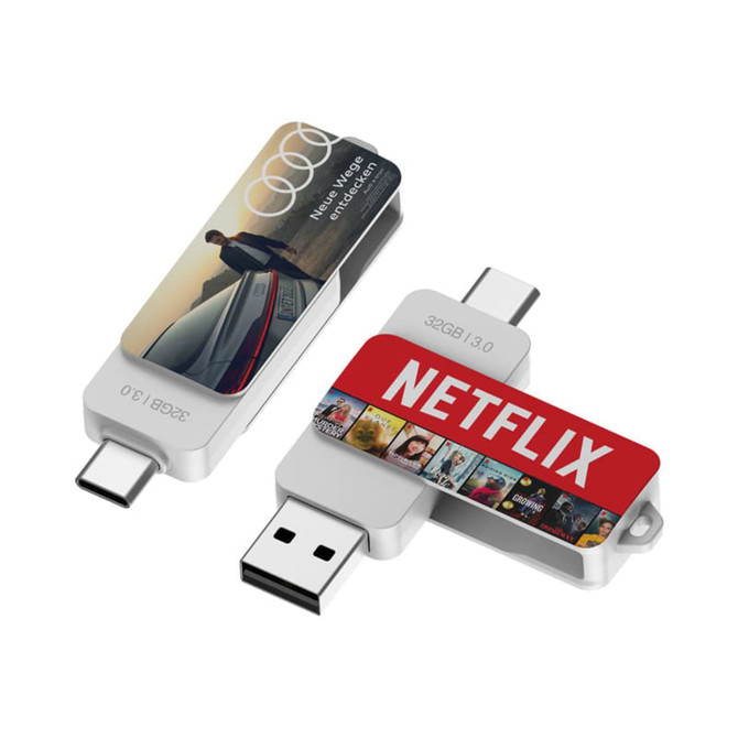 A Twister Type-C Flash Drive in silver and red, featuring a logo and an image on one side.