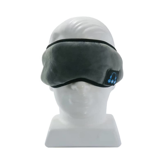 A grey Bluetooth eye mask is displayed on a white head model, featuring a logo on the side.