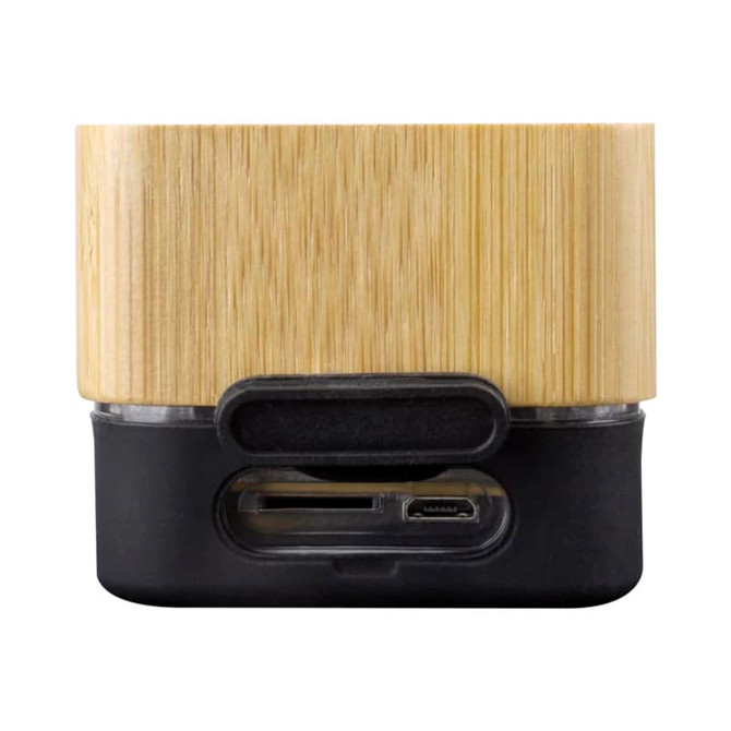 A wireless speaker with a bamboo exterior and a black base, featuring ports for connections.