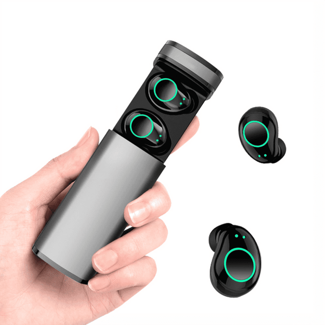 A hand holding a sleek grey charging case with black Royston TWS earbuds featuring green accents.