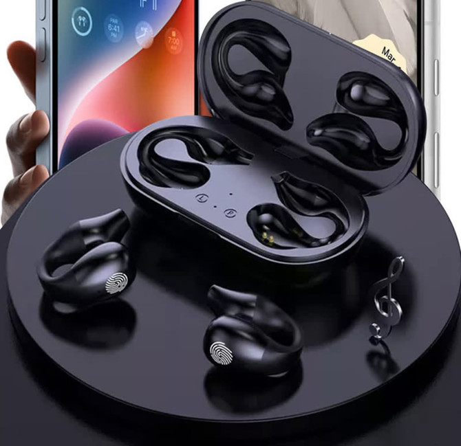 Black Clipz TWS earbuds displayed in a charging case, with a smartphone partially visible in the background.