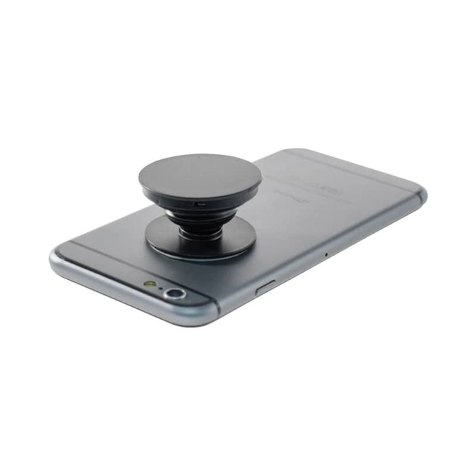 A black phone stand positioned on the back of a grey smartphone, featuring a circular design.