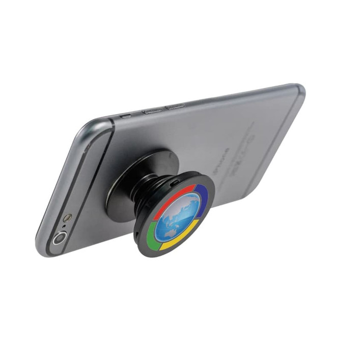 A black phone stand with a colourful circular design attached to the back of a smartphone.