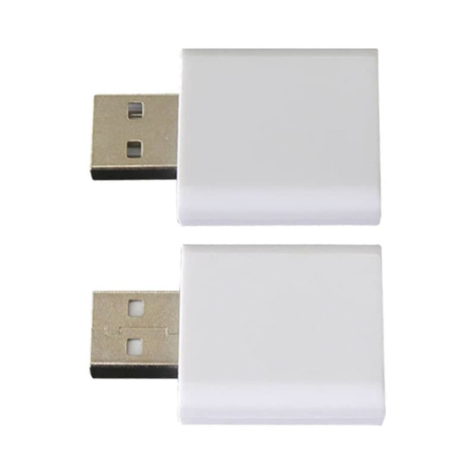 A pair of white USB data blockers with metallic connectors on one side, featuring a simple design.