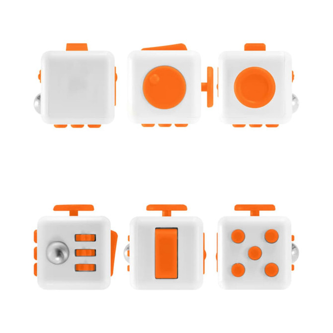A fidget cube in white and orange, featuring various tactile buttons and switches for sensory play.