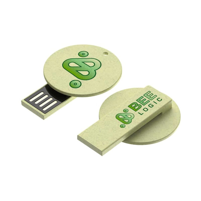 A green and cream circular flash drive featuring a logo and a sliding connector. The design is eco-friendly.