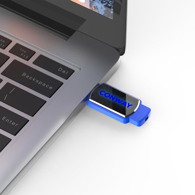 A blue flash drive is plugged into a laptop USB port, featuring a branded logo on its body.