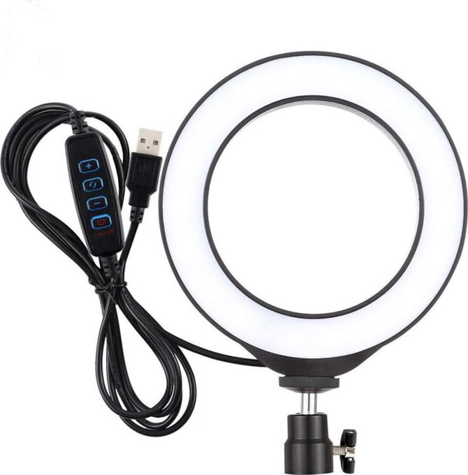 A 6-inch round LED halo light in white with a black adjustable stand and a connected USB cable featuring control buttons.