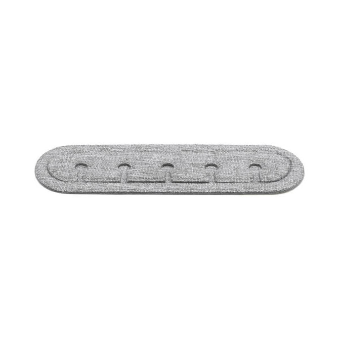 A grey cable organiser made from RPET material featuring multiple slots for holding cables. It has a simple, textured design.