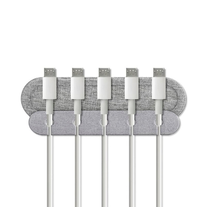 A grey cable organiser with several white charging cables neatly arranged on it. It features a branding logo.