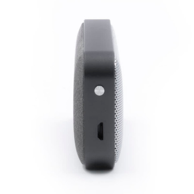 A side view of a black and grey Nano Vegan Wireless Speaker, featuring a sleek design and a small port.