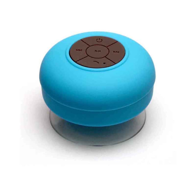 A round, blue waterproof Bluetooth speaker with a control panel on top, featuring a clear bottom.