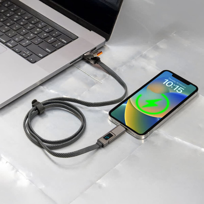 A grey charging cable connected to a laptop and a mobile phone, featuring a flexible design and a branding logo.