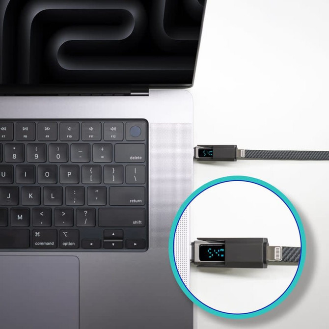 A fast charging cable in black connected to a laptop, featuring a digital display for charging information.