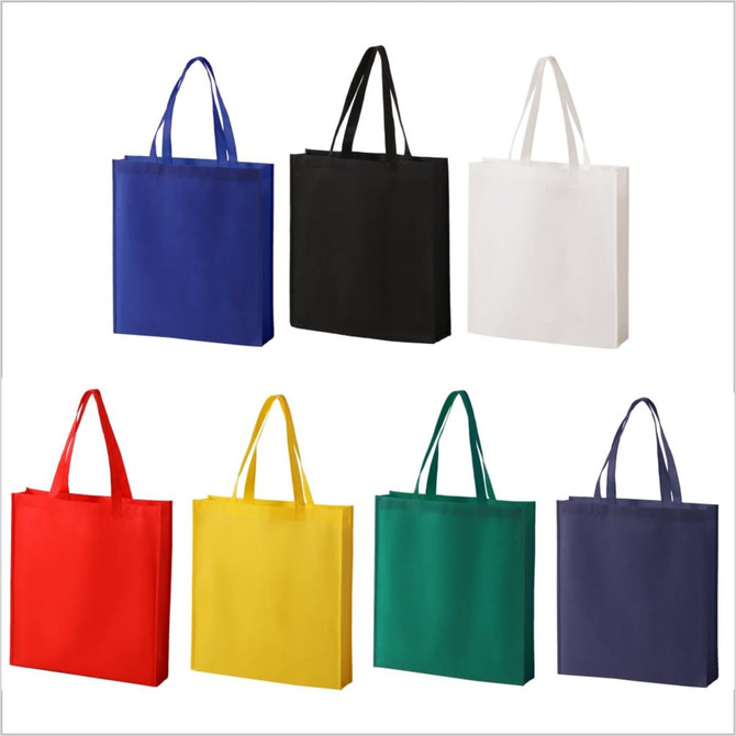 A set of eight reusable tote bags in blue, black, white, red, yellow, green, and purple, featuring sturdy handles.