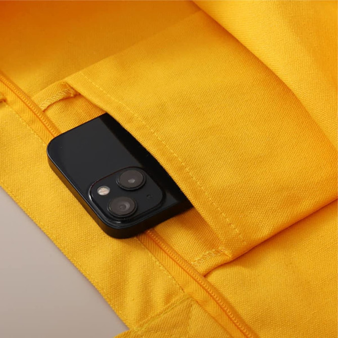 A yellow fabric pouch with a black smartphone partially visible inside. The pouch features a zipper closure.