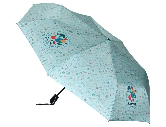 A mint green umbrella with a playful pattern and a logo. Features a manual opening mechanism.