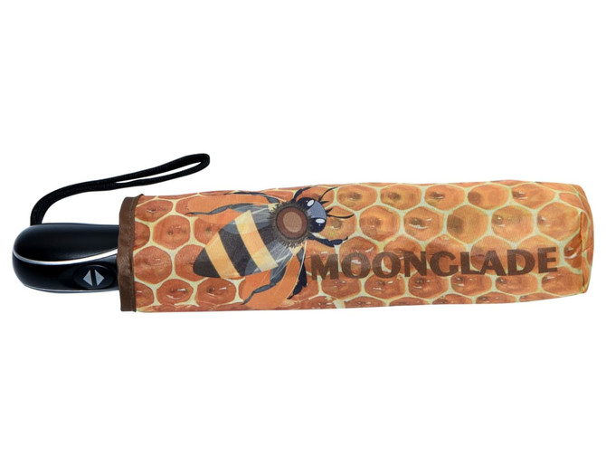 A full colour umbrella with a honeycomb and bee design, featuring a black handle and strap.