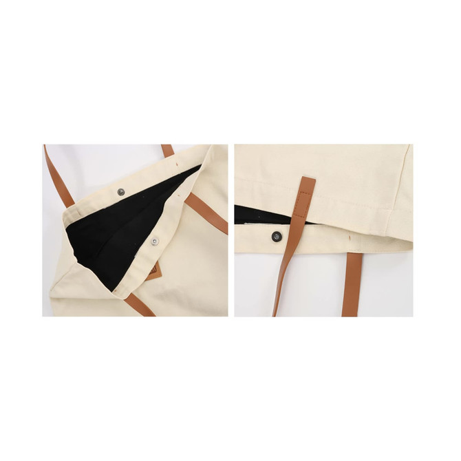 A cream canvas bag with brown leather straps, featuring a black interior and snap closures. Includes branding.