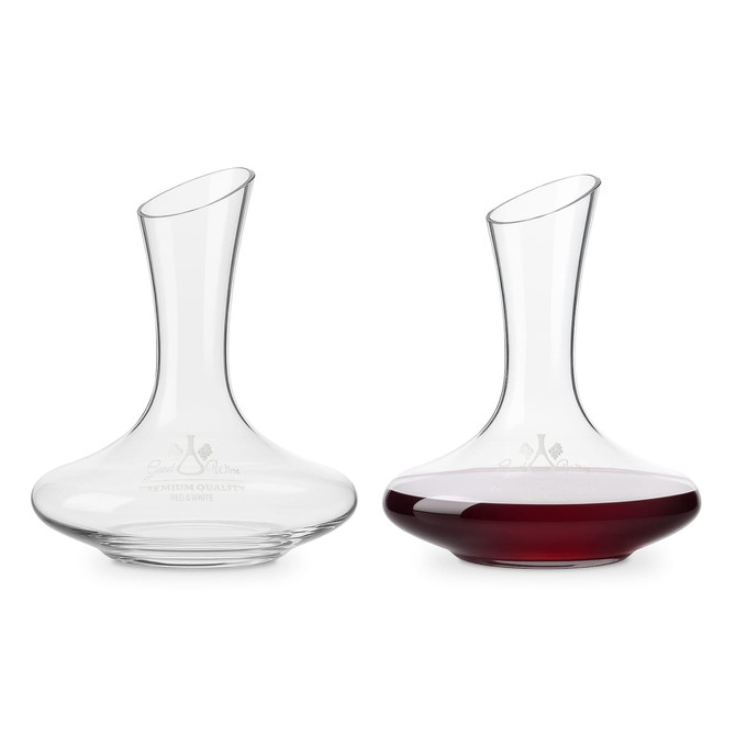 A glass wine decanter with a curved design, showcasing clear glass and rich red wine inside. It has a logo.