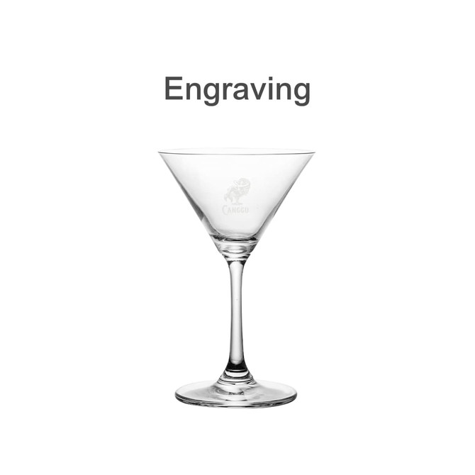 A classic martini glass, clear with a tapered bowl and a stable base, featuring a logo engraving.