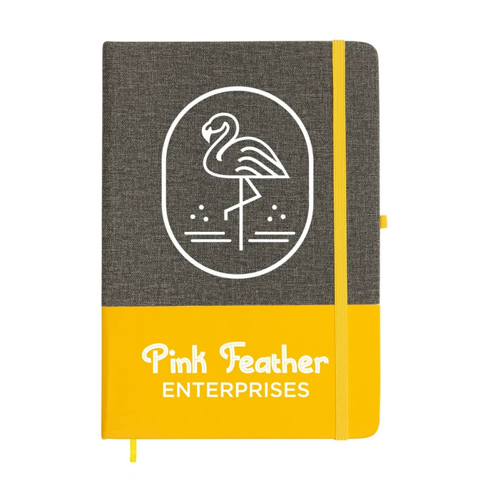 A grey and yellow A5 notebook with an illustration of a flamingo and a logo on the cover.
