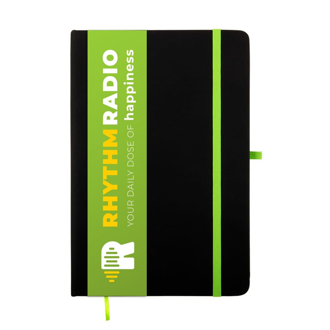 A black A5 notebook with a green and white branded sleeve and a matching green elastic band closure.