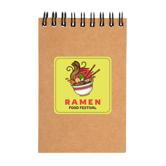 A spiral-bound notebook in brown with a vibrant ramen-themed design on the cover.
