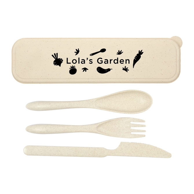 A cutlery set in a cream-coloured case, featuring a spoon, fork, knife, and a logo.