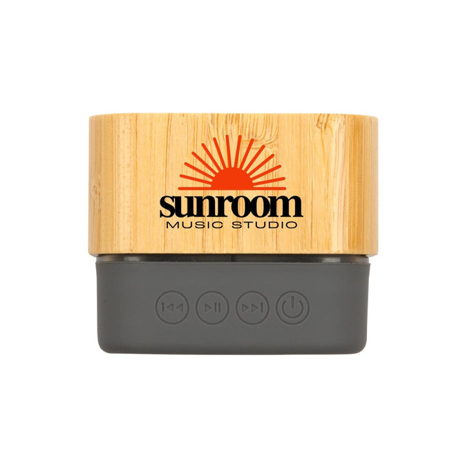 A Bluetooth speaker featuring a bamboo exterior and a grey base, with a logo displayed on the front.