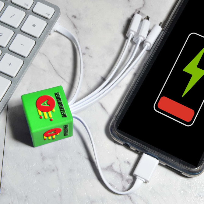 A green Cube Topper PVC cable connected to a phone and a computer, with multiple charging connectors.