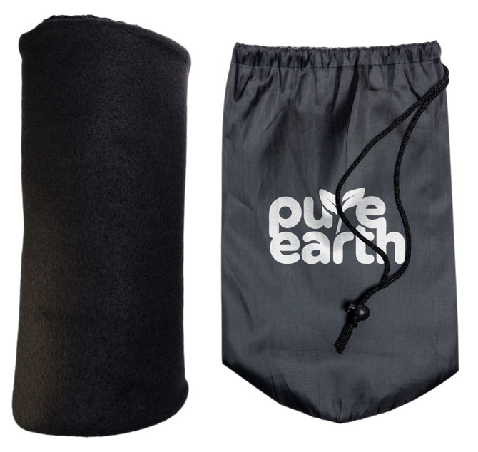 A soft black Polar Blanket rolled up beside a drawstring bag featuring the "Pure Earth" logo.