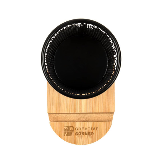A black wire mesh pen tidy with a bamboo base. The base features a logo.