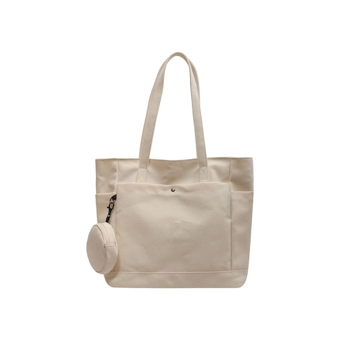 A casual beige canvas bag featuring two handles and a small round accessory pouch attached.