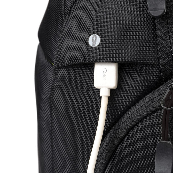 A black backpack featuring a USB charging port and a textured fabric design, with a logo on the front.
