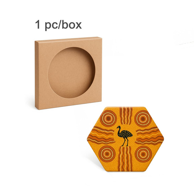 A hexagonal ceramic coaster in yellow with Aboriginal-inspired patterns, packaged in a plain brown box.