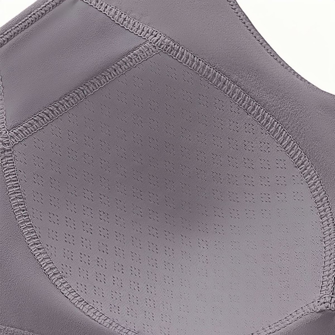 A grey seamless thin-strap racerback yoga bra tank featuring a textured pattern and a logo on the side.