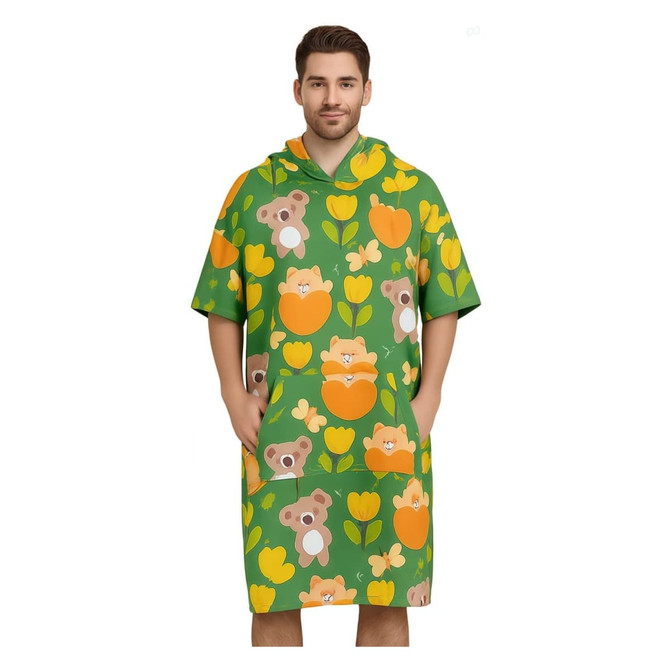 A green hooded towel poncho featuring a playful pattern of koalas and flowers. It includes pockets and a vibrant design.