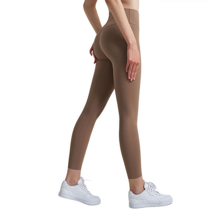 High-waisted elastic LYCRA leggings in a brown shade, worn with white sneakers, featuring a fitted design.