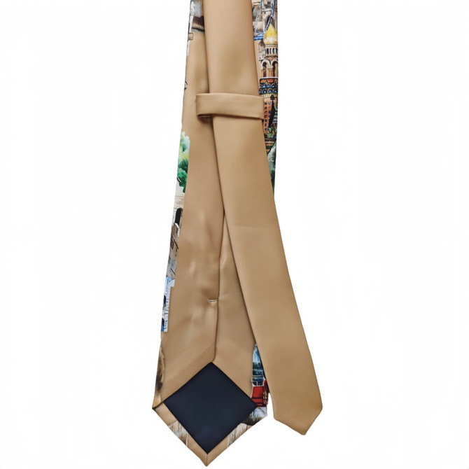 A printed tie featuring a mix of vibrant patterns on a base of beige and navy blue, with branding visible.