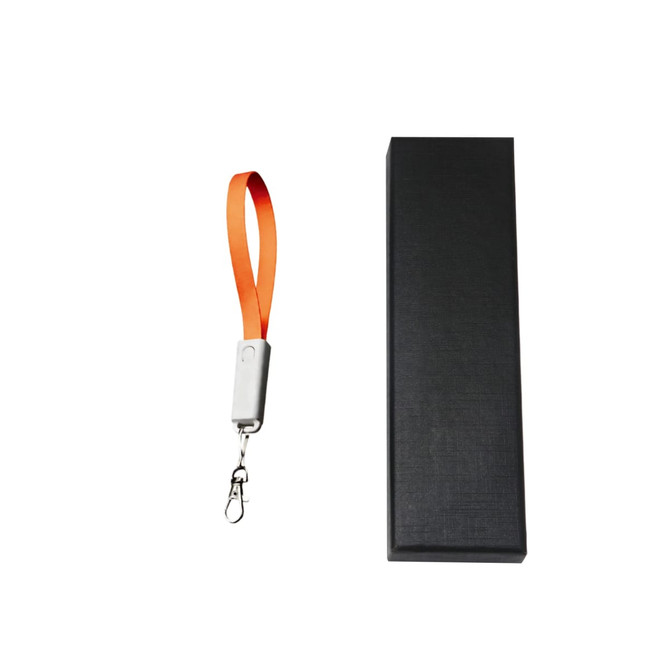 An orange charging cable strap with a silver clip beside a sleek black box.