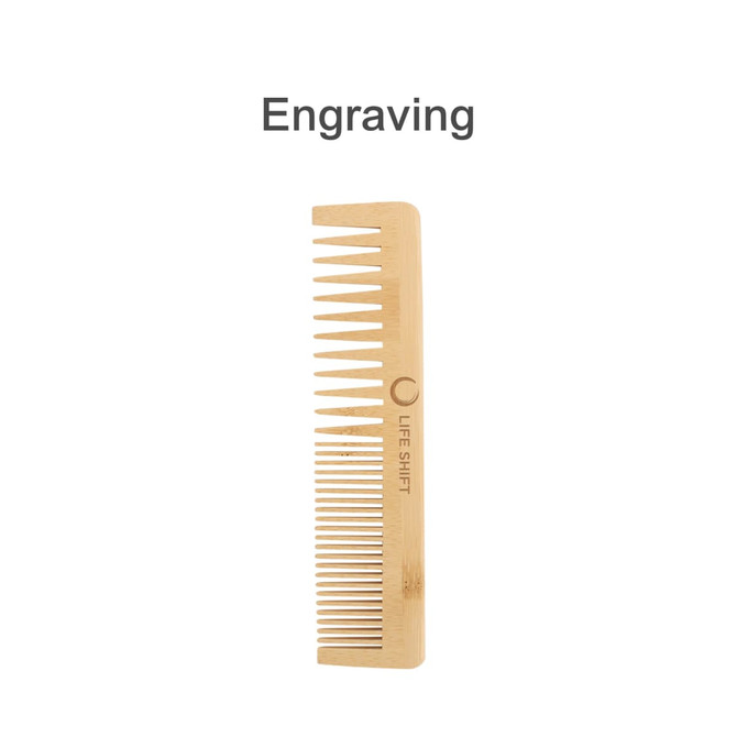 A bamboo comb with fine and wide teeth, featuring a logo and engraving, in a natural wood colour.