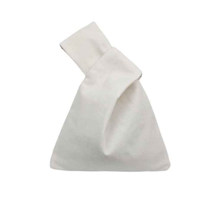 A cotton wrist bag in a simple white design, featuring a fold-over top and a single handle.