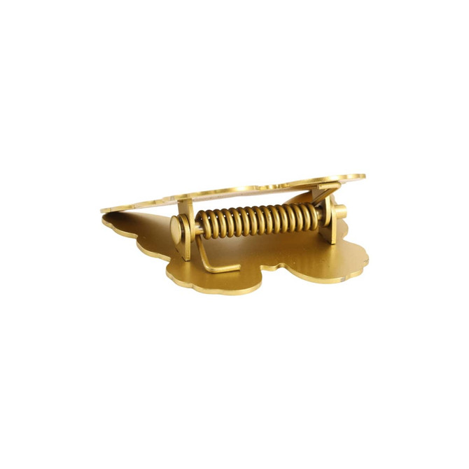 A gold metal clip with a butterfly shape and a coiled spring mechanism, featuring a logo on its base.
