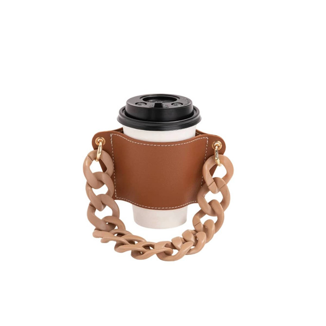 A drink bottle holder in brown leather with a chunky acrylic strap, designed to carry a coffee cup securely.