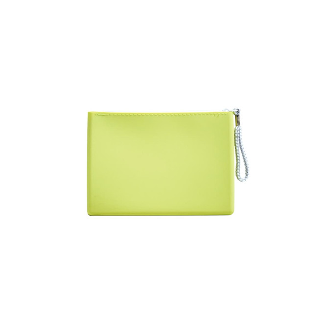 A yellow silicone cosmetic pouch with a textured surface and a silver bead chain zipper.