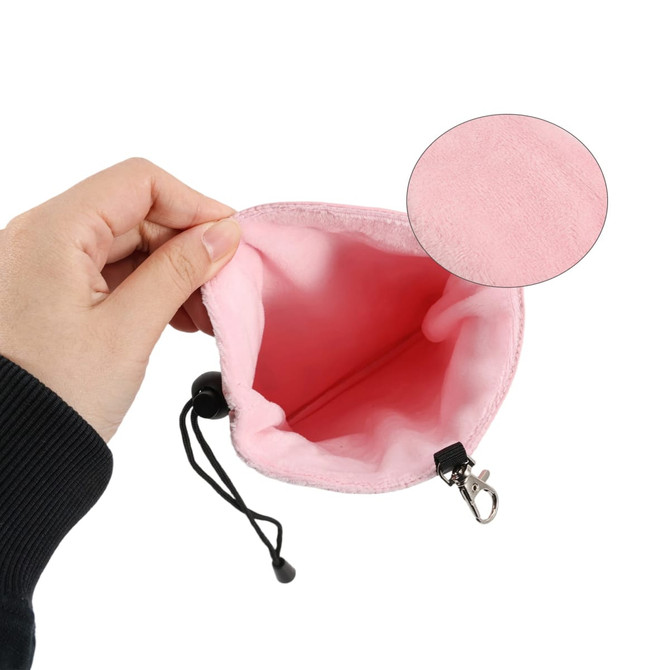 A pink PU golf valuables pouch with a soft interior, featuring a drawstring and clip for closure.