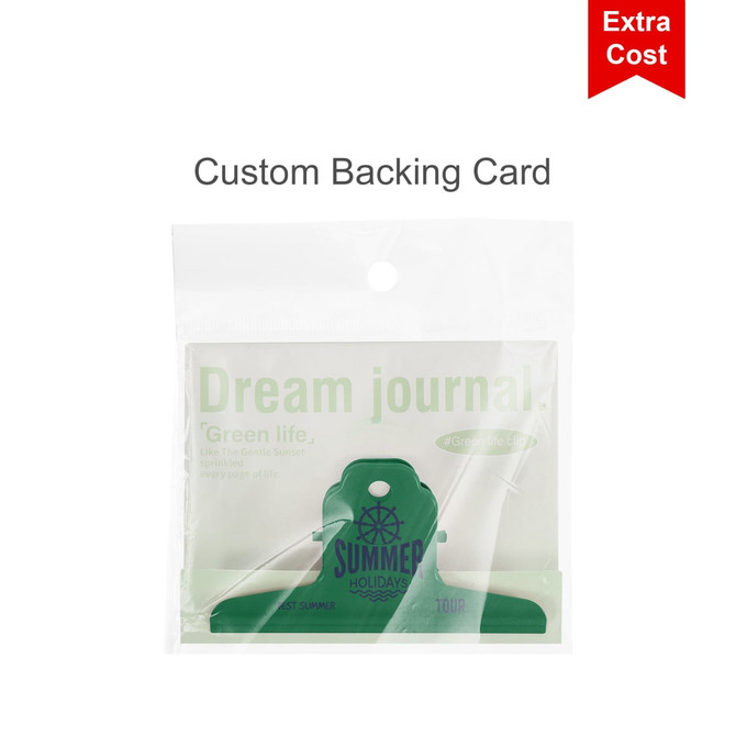 A clear packaging featuring a green custom backing card with a binder clip design, labelled "Dream journal."